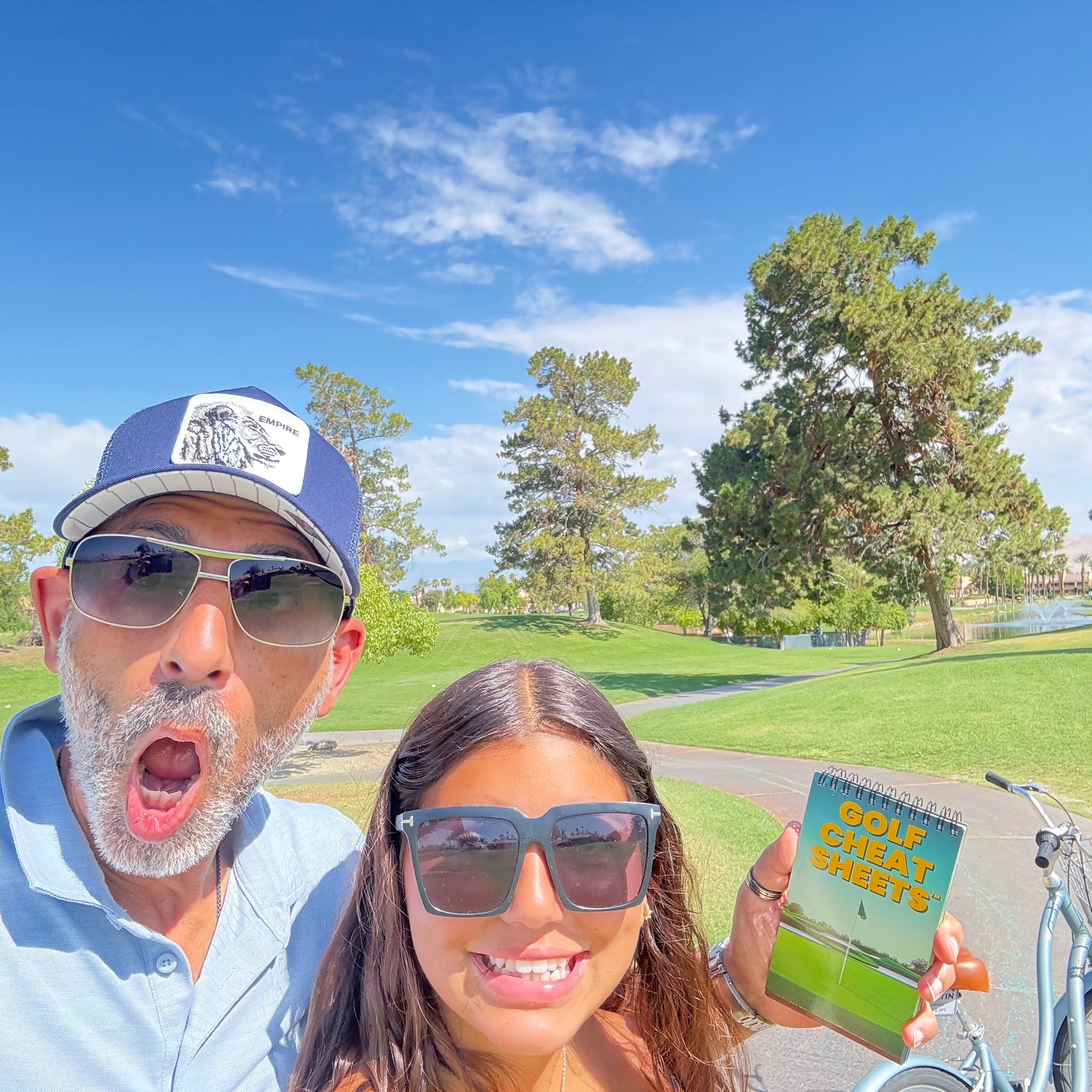 Couple enjoying Golf Cheat Sheets on the course