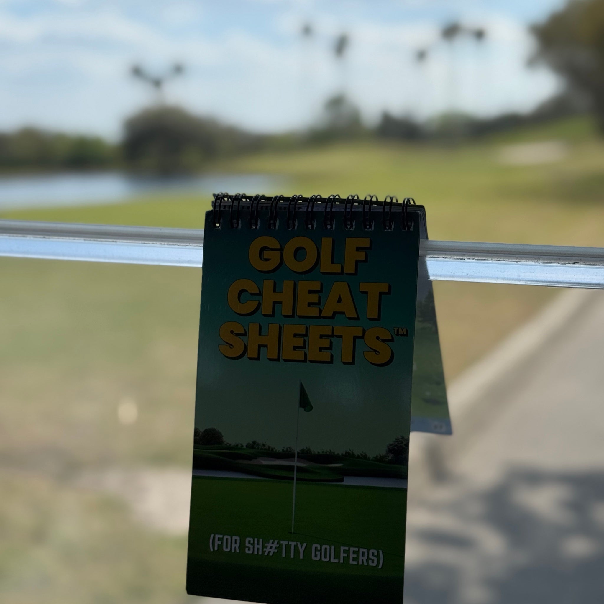 Golf Cheat Sheets clipped to golf cart — always within reach